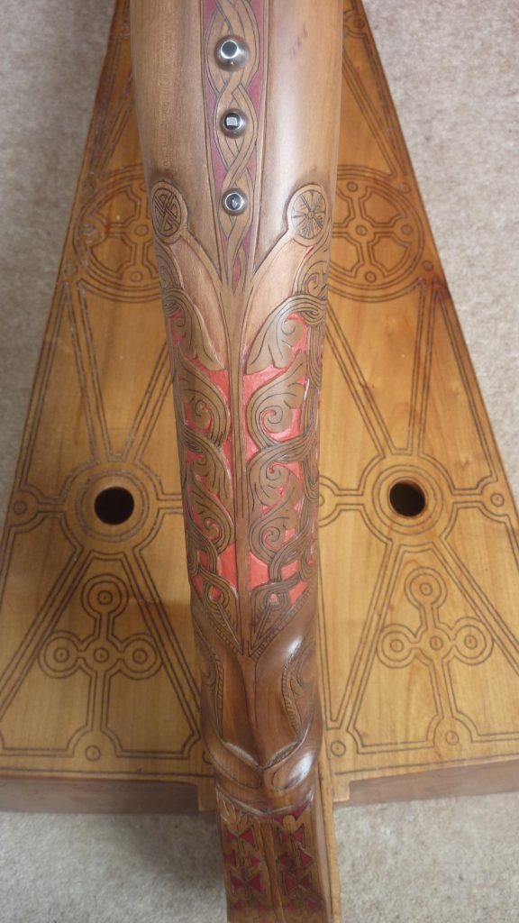 Vermillion paint on the forepillar of the replica Queen Mary harp